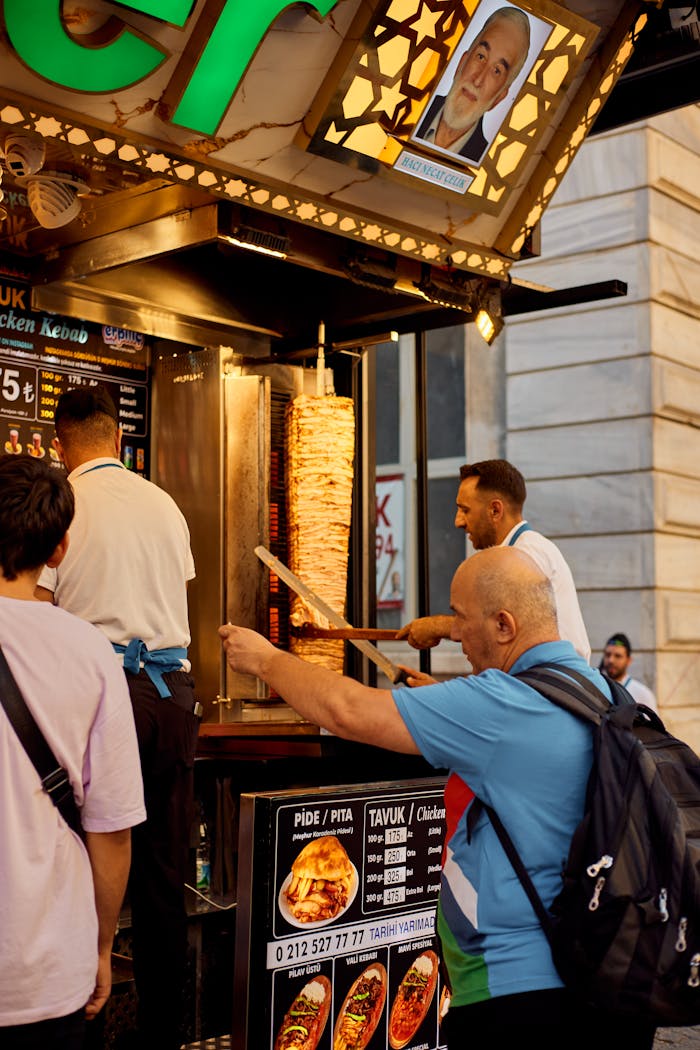 A busy scene of a street vendor preparing doner kebab in Istanbul, capturing the lively atmosphere.